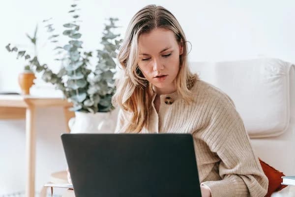 Woman using a laptop at home