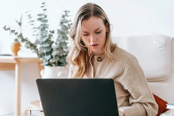 Woman using a laptop at home